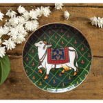 Beautiful Kamadhenu: Green Hand Painted Wall Plate with Cow & Diya on it - By Sanskruti Artz 4