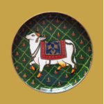 Beautiful Kamadhenu: Green Hand Painted Wall Plate with Cow & Diya on it - By Sanskruti Artz