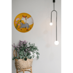 Beautiful Kamadhenu: Hand Painted Celestial Cow of Abundance Yellow Wall Plate on Light Pink Wall - By Sanskruti Artz