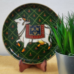 Beautiful Kamadhenu: Green Hand Painted Wall Plate with Cow & Diya on it - By Sanskruti Artz 3